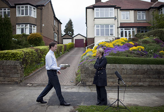 Clegg on polling day: Nick Clegg offers a cup cake to Sky News reporter