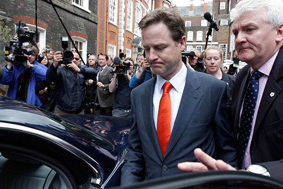 day after election night: Liberal Democrat leader Nick Clegg leaves his party headquarters