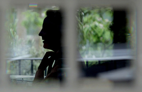 Saturday Politics: Conservative Party leader David Cameron adjusts his tie