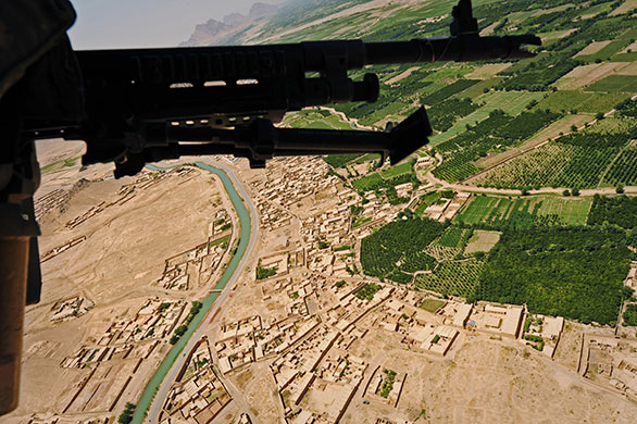 24 Hours in Pics: US soldiers fly in a Blackhawk helicopter in Kandahar