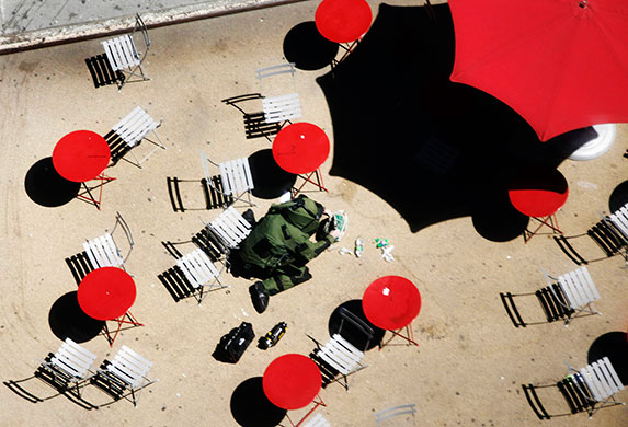 24 Hours in Pics: A member of the NYPD Bomb Squad examines a suspicious package in New York