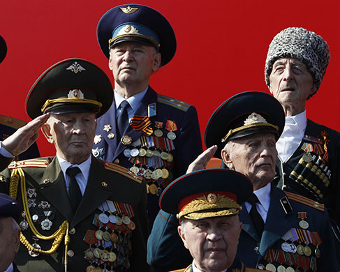Victory parade: World War Two veterans salute as they watch the parade in Red Square