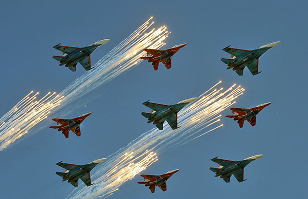 Victory parade: Russian Su-27 and MiG-29 fighter jets shoot flares