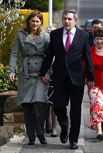 Hung parliament talks: Prime Minister Gordon Brown walks with his wife Sarah to church
