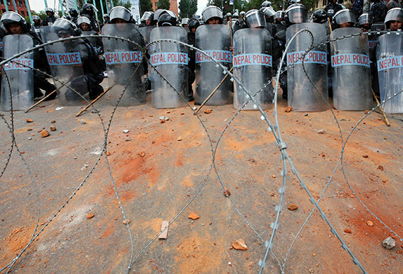 24 hours: Kathmandu, Nepal: Nepalese riot police group in a defensive formation