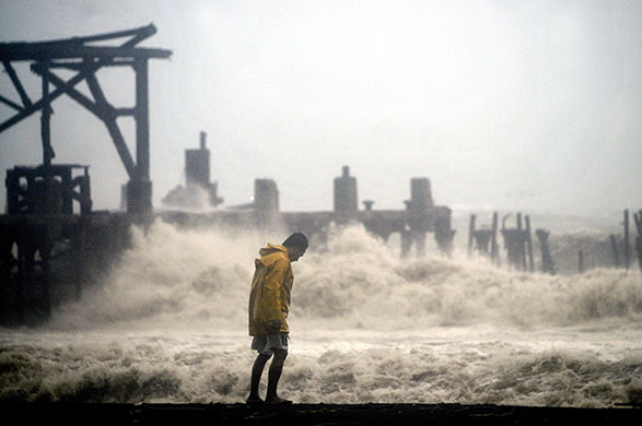 Guatemala storm: 29 May: A man stands in the Puerto San Jose beaches