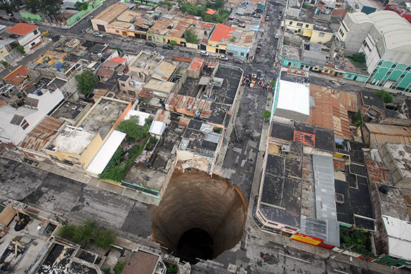 24 hours in pictures: Guatemala City, Guatemala: A sinkhole covers a street intersection