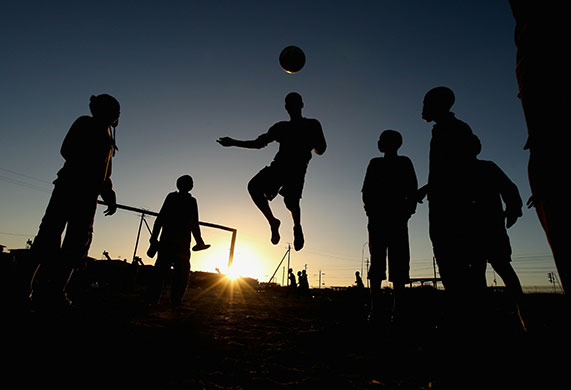 24 hours in pictures: Cape Town, South Africa: Children play football in the Kayelitsha Township
