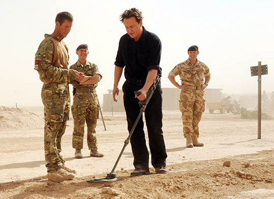 Cameron in Afghanistan: David Cameron tries out a metal detector