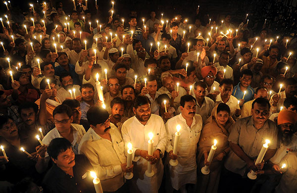 24 hours in pictures: Bhopal, India: People take part in a vigil
