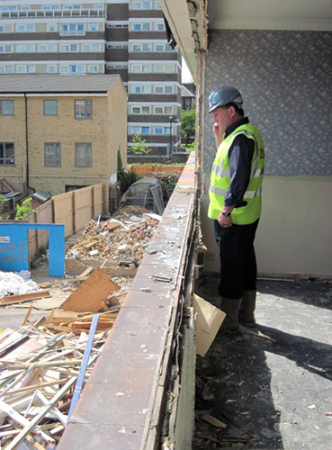 Market Estate Demolition: Bob Thurgood stands by the window of a dismantled living room at Tamworth