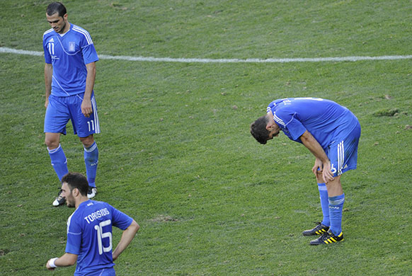 south korea: Greece's players react st the end of the