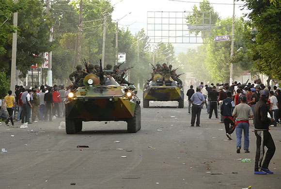 Kyrgyzstan violence: Soldiers drive armoured vehicles in the city of Osh in southern Kyrgyzstan