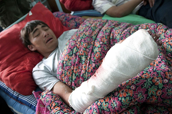 Kyrgyzstan violence: A boy, an Ethnic Uzbek reportedly shot during recent clashes, lies injured