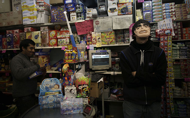 24 hours: Tucuman, Argentina: A soccer fan wears a Diego Maradona mask 