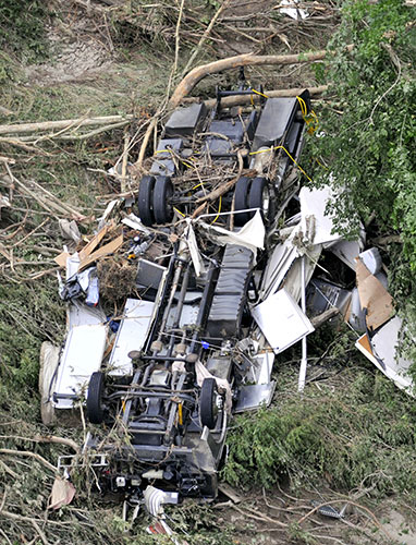 Arkansas floods: A camper lies overturned after being washed down stream 