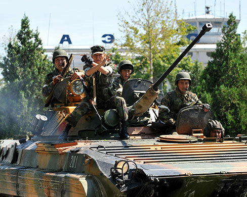 Kyrgyzstan violence: Kyrgyz soldiers patrol and secure the area near the airport in Osh 