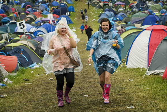 24 hours in pictures: Inverness, UK: Festival goers endure the rain