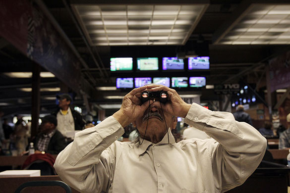 24 hours in pictures: Inglewood, US: Manuel Morales looks through binoculars