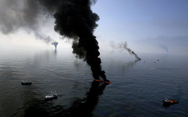 24 hours in pictures: Gulf of Mexico: Smoke billows from a controlled burn of spilled oil