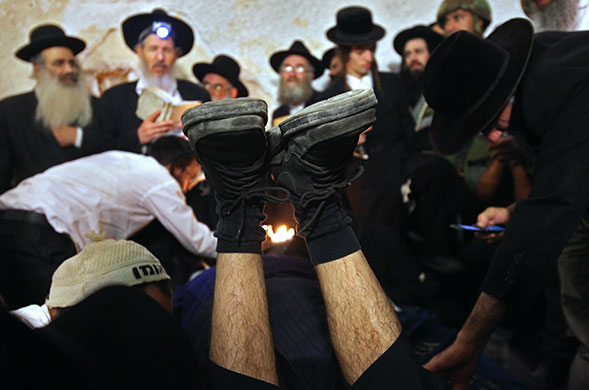 24 hours in pictures:  jews make midnight pilgrimage to biblical tomb in nablus, west bank
