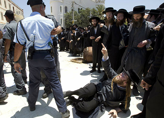 24 hours in pictures: Ultra-Orthodox Jews protest