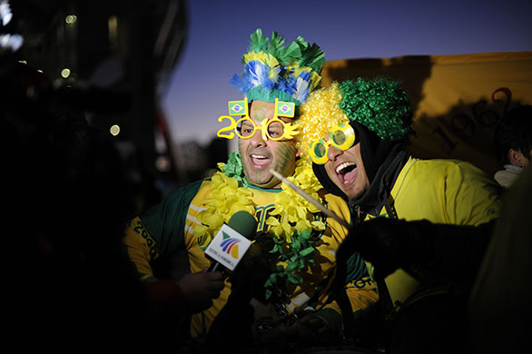 Brazil v North Korea: A couple of Brazilian fans are interviewed by Mexican TV outside the ground