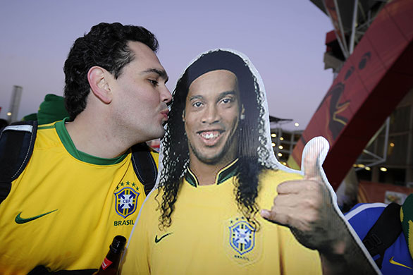 Brazil v North Korea: Fan kisses a Ronaldinho cardboard cut-out