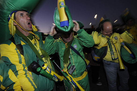 Brazil v North Korea: Brazilian fans with air-horns and big hats