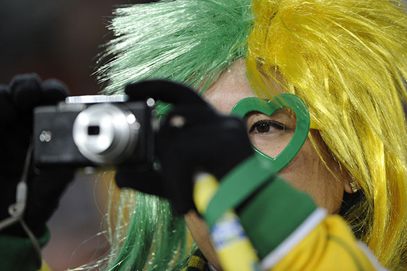 Brazil v North Korea: Brazil fan photographs the players warming up