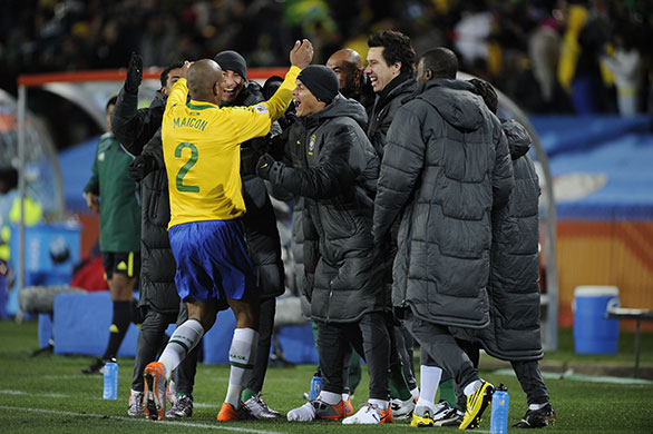 Brazil v North Korea: Maicon celebrates his goal with the Brazil bench