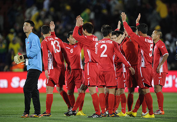 Brazil v North Korea: The North Koreans wave to their fans after the final whistle goes