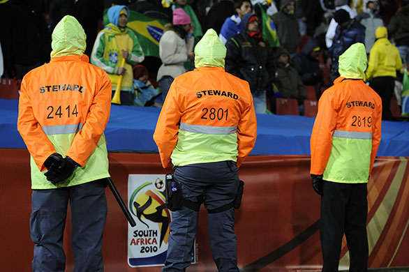 Brazil versus North Korea: Police dressed as stewards watch over the crowd 