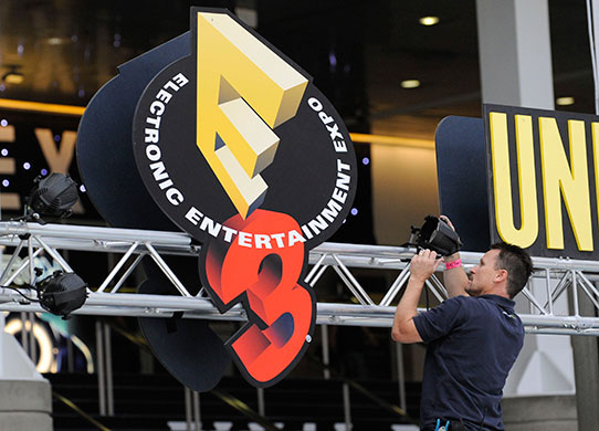 E3 Expo: Trade show installer sets up lights at the E3 Expo Convention Centre
