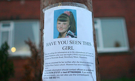 Local residents put up a poster of Shannon Matthews in Leeds