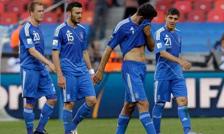 Greek players leave the pitch after South Korea defeat in 2010 World Cup