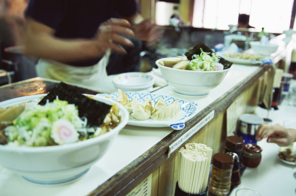 Ramen noodles: Ramen and dumplings on the bar at a restaurant in Shinjuku, Tokyo, Japan