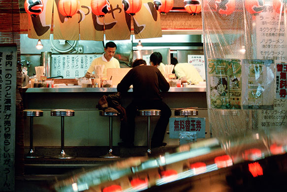 Ramen noodles: A man sits at a Ramen noodle restaurant in Tokyo Japan