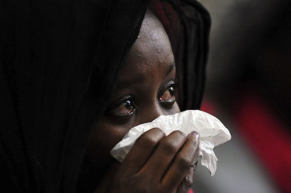 Zenani Mandela memorial: A mourner cries at the memorial service of Zenani Mandela