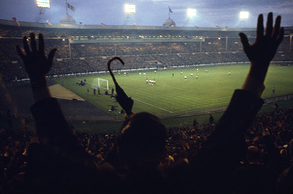 1966 never seen before: Arms and umbrellas are raised in exultation at Wembley