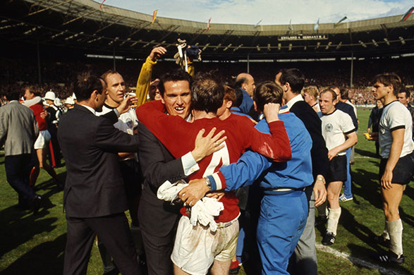 1966 never seen before: Players and coaches mill around following England's victory in 1966