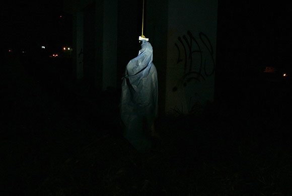 24 hours in pictures: Guadalajara, Mexico: The covered body of a man hangs underneath a bridge