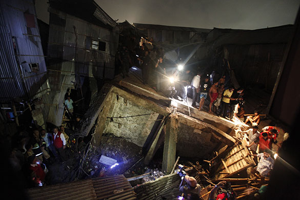 24 hours in pictures: Dhaka, Bangladesh: Firefighters and locals try to rescue people
