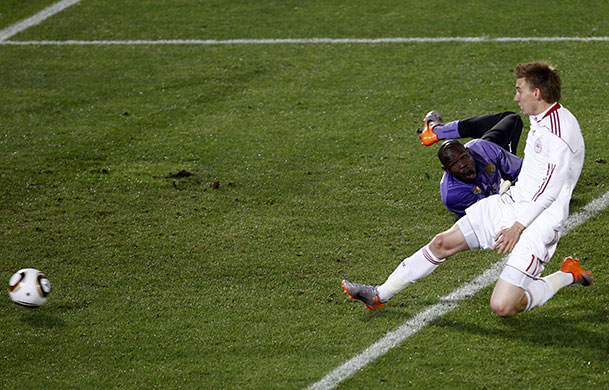 World Cup day 10: Denmark's Bendtner slides in to score past Cameroon's goalkeeper