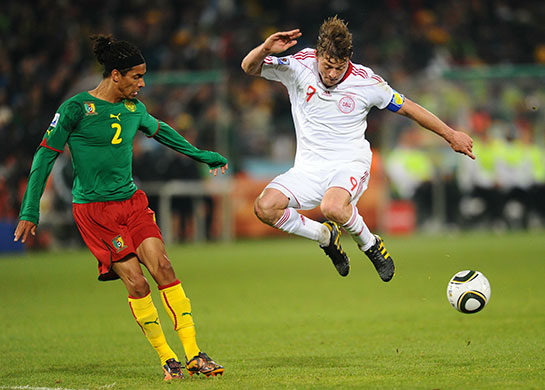 World Cup day 10: Jon Dahl Tomasson challenges Cameroon's Benoit Assou-Ekotto