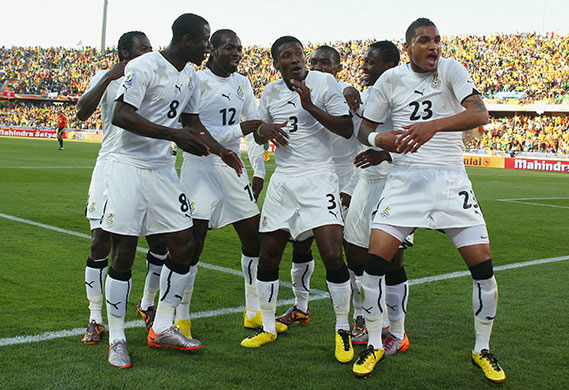 World Cup day 10: Asamoah Gyan celebrates with team-mates after equalising against Australia