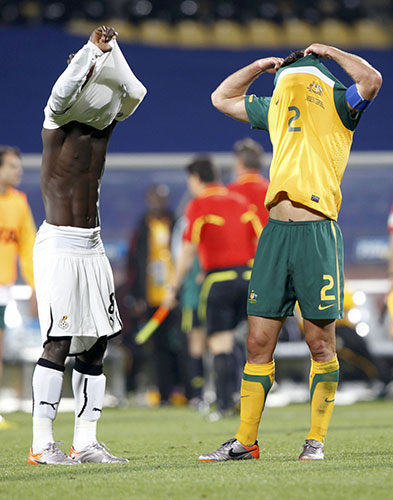 World Cup day 10: Ghana's Mensah and Australia's Neill exchange jerseys