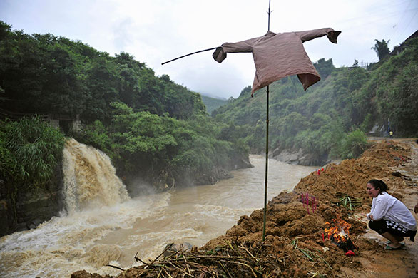 Chian flooding: A Chinese woman mourns her family member killed by flash floods in Nanping