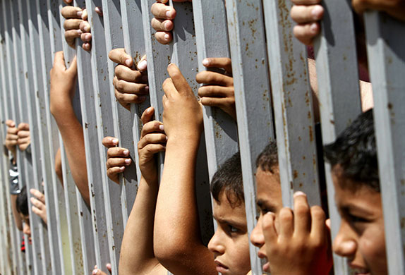 24 hours in pictures: Palestinian Children demonstrate Gaza City