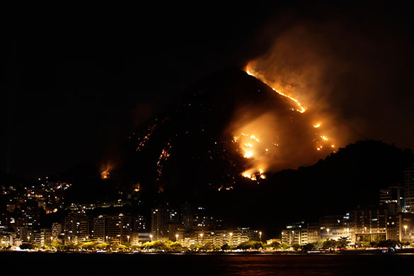 24 hours in pictures: Rio de Janeiro, Brazil: Smoke billows from fires